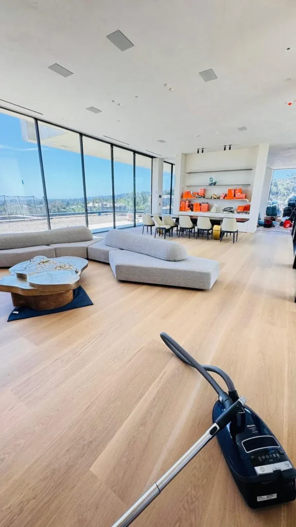 Hardwood floor vacuuming in a luxury Los Angeles home