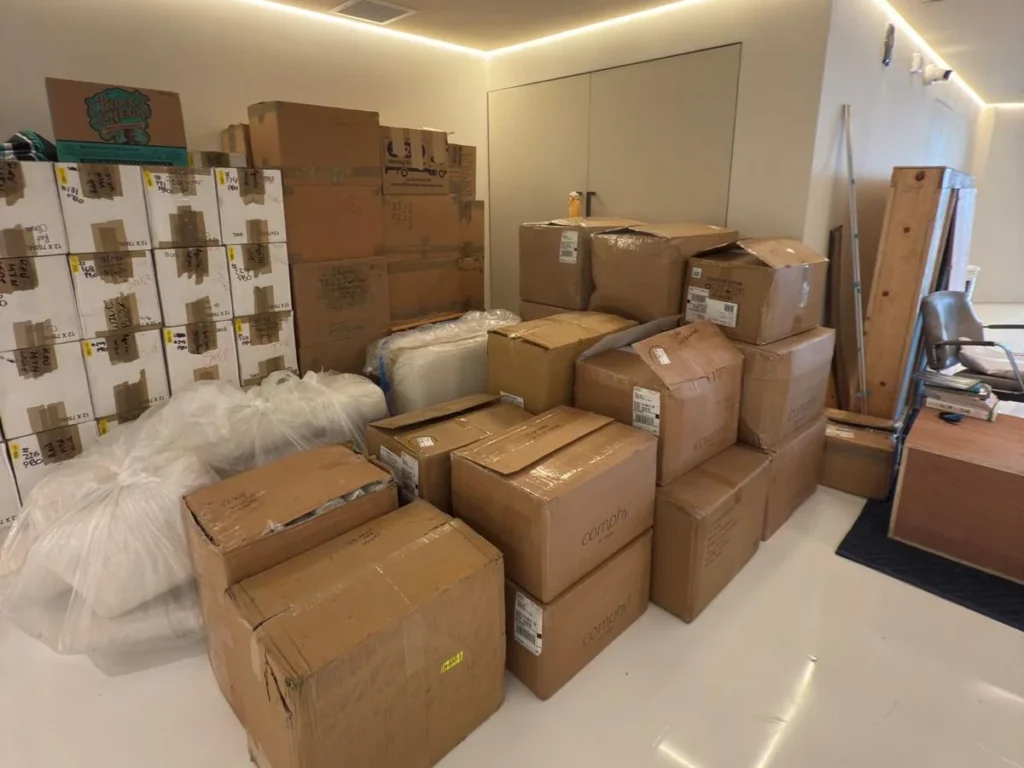 Move-out packing in progress: labeled boxes prepared by FJ Luxury Services in a Los Angeles luxury home